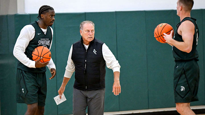 Michigan State's coach Tom Izzo, left, talks with Coen Carr, left, and Denham Wojcik during the first day of basketball practice on Monday, Sept. 22, 2025, at the Breslin Center in East Lansing.