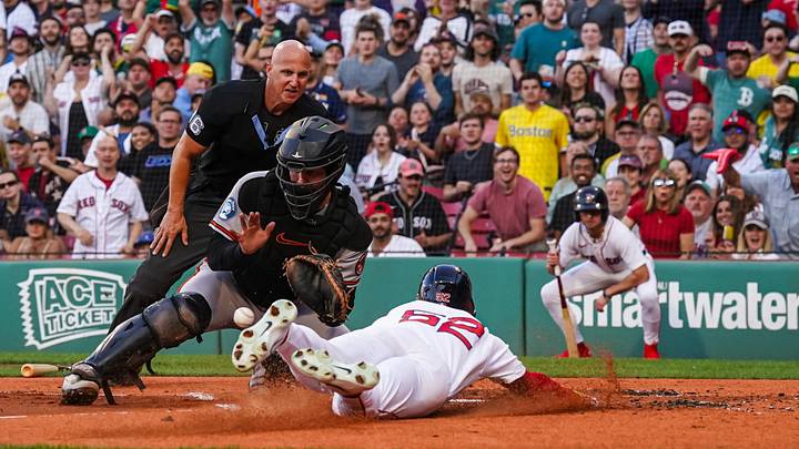 Jun 3, 2026; Boston, Massachusetts, USA; Boston Red Sox right fielder Wilyer Abreu (52) called out at home plate against Baltimore Orioles catcher Adley Rutschman (35) in the first inning at Fenway Park. Mandatory Credit: David Butler II-Imagn Images