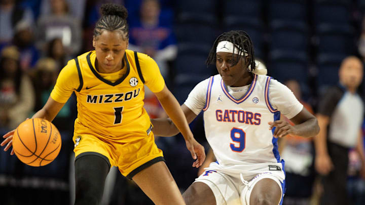 Missouri guard Shannon Dowell (1) tries to get around Florida guard Alexia Dizeko (9) during the first half of an NCAA Women’s basketball game at Exactech Arena in the Steven C. O'Connell Center in Gainesville, FL on Sunday, January 18, 2026. [Alan Youngblood/Gainesville Sun]