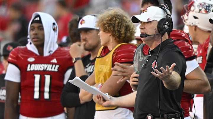 Sep 7, 2024; Louisville, Kentucky, USA; Louisville Cardinals head coach Jeff Brohm reacts on the sideline during the second half against the Jacksonville State Gamecocks at L&N Federal Credit Union Stadium. Louisville defeated Jacksonville State 49-14. Mandatory Credit: Jamie Rhodes-Imagn Images Sep 7, 2024; Louisville, Kentucky, USA; Louisville Cardinals head coach Jeff Brohm reacts on the sideline during the second half against the Jacksonville State Gamecocks at L&N Federal Credit Union Stadium. Louisville defeated Jacksonville State 49-14. Mandatory Credit: Jamie Rhodes-Imagn Images