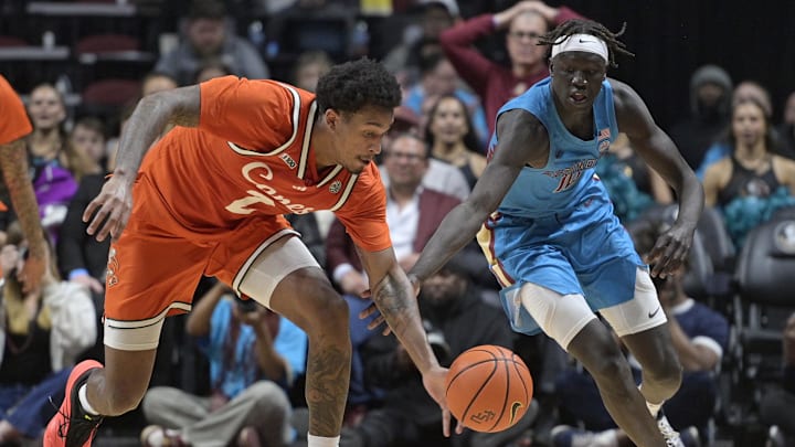 Feb 19, 2025; Tallahassee, Florida, USA; Miami Hurricanes forward Brandon Johnson (2) and Florida State Seminoles forward Taylor Bol Bowen (10) fight for a loose ball during the second half of the game at Donald L. Tucker Center. Mandatory Credit: Melina Myers-Imagn Images Feb 19, 2025; Tallahassee, Florida, USA; Miami Hurricanes forward Brandon Johnson (2) and Florida State Seminoles forward Taylor Bol Bowen (10) fight for a loose ball during the second half of the game at Donald L. Tucker Center. Mandatory Credit: Melina Myers-Imagn Images