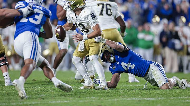 BYU linebacker Cade Uluave pressures Notre Dame QB CJ Carr BYU linebacker Cade Uluave pressures Notre Dame QB CJ Carr
