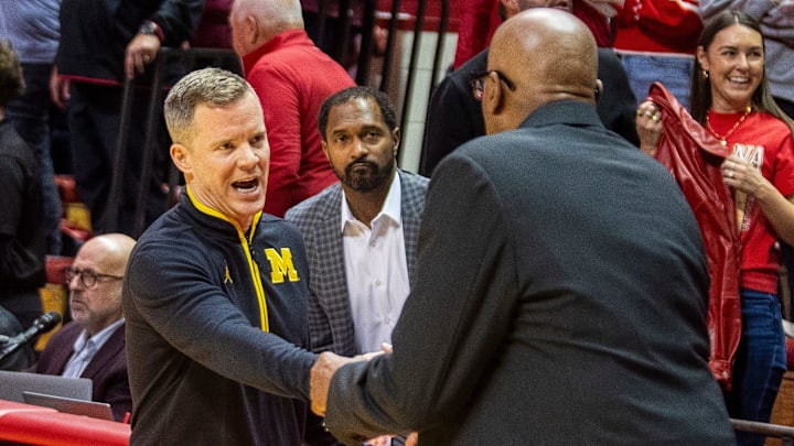 Michigan coach Dusty May shakes hands with Indiana coach Mike Woodson at Simon Skjodt Assembly Hall. Michigan coach Dusty May shakes hands with Indiana coach Mike Woodson at Simon Skjodt Assembly Hall.