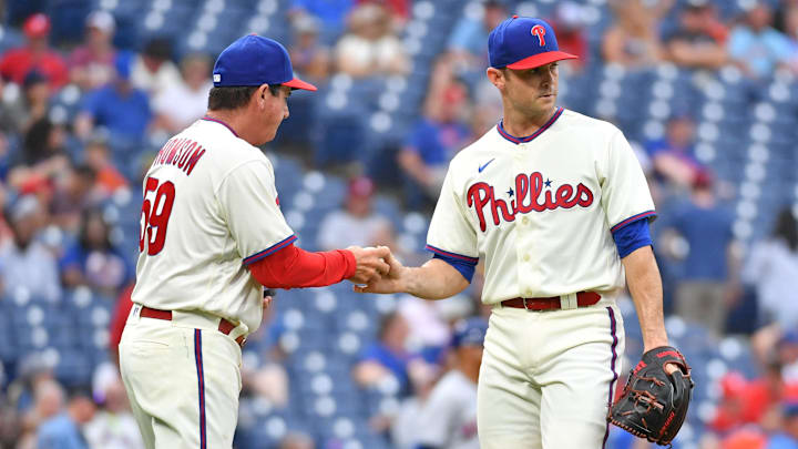 Aug 21, 2022; Philadelphia, Pennsylvania, USA; Philadelphia Phillies interim manager Rob Thomson (59) takes the ball relief pitcher David Robertson (30) during the ninth inning against the New York Mets at Citizens Bank Park. Mandatory Credit: Eric Hartline-Imagn Images