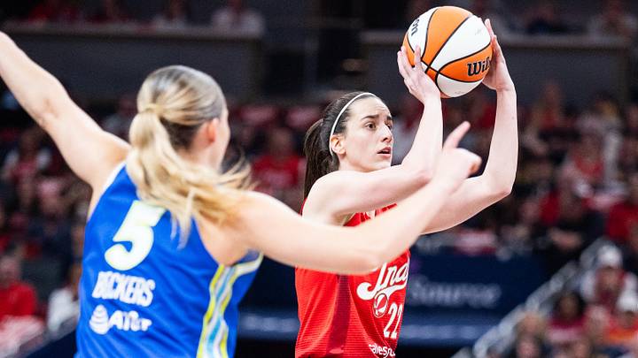 May 9, 2026; Indianapolis, Indiana, USA; Indiana Fever guard Caitlin Clark (22) shoots the ball while Dallas Wings guard Paige Bueckers (5) defends in the first half at Gainbridge Fieldhouse. Mandatory Credit: Trevor Ruszkowski-Imagn Images