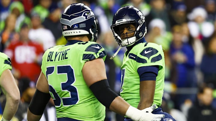 Dec 15, 2022; Seattle, Washington, USA; Seattle Seahawks quarterback Geno Smith (7) reacts towards guard Austin Blythe (63) following a sack against the San Francisco 49ers during the first quarter at Lumen Field. Mandatory Credit: Joe Nicholson-Imagn Images