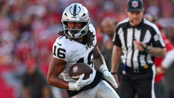 Dec 8, 2024; Tampa, Florida, USA; Las Vegas Raiders wide receiver Jakobi Meyers (16) runs with the ball against the Tampa Bay Buccaneers in the fourth quarter at Raymond James Stadium. Mandatory Credit: Nathan Ray Seebeck-Imagn Images
