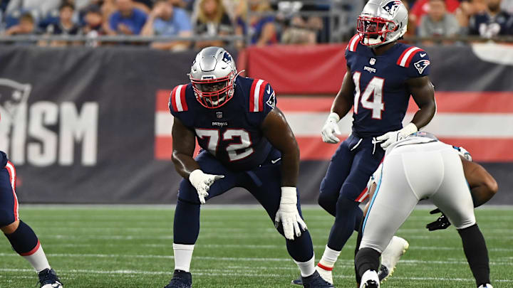 New Miami Dolphins offensive tackle Yodny Cajuste (72) lines up during the first half of a preseason game for the New England Patriots against the Carolina Panthers at Gillette Stadium in 2022.