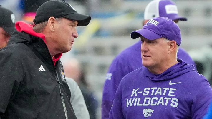 Oct 25, 2025; Lawrence, Kansas, USA; Kansas Jayhawks head coach Lance Leipold, left, talks with Kansas State Wildcats head coach Chris Klieman prior to a game at David Booth Kansas Memorial Stadium. Mandatory Credit: Denny Medley-Imagn Images