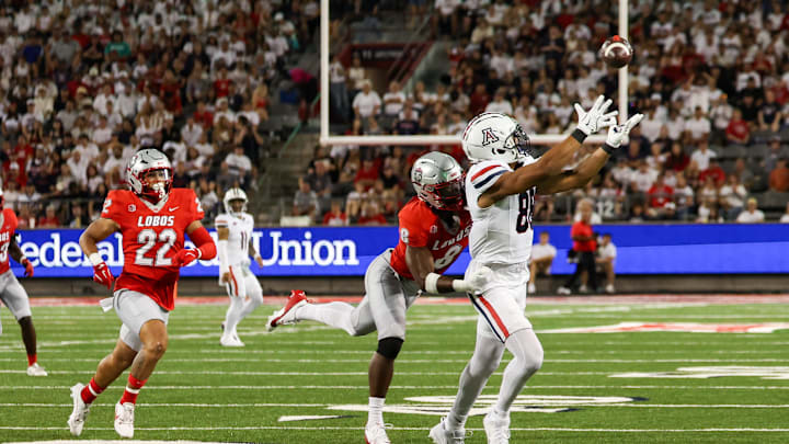 Aug 31, 2024; Tucson, Arizona, USA; New Mexico Lobos safety Christian Ellis (8) goes in to tackle Arizona Wildcats tightend Keyan Burnett (88) while he catches the ball during first quarter at Arizona Stadium. Mandatory Credit: Aryanna Frank-Imagn Images Aug 31, 2024; Tucson, Arizona, USA; New Mexico Lobos safety Christian Ellis (8) goes in to tackle Arizona Wildcats tightend Keyan Burnett (88) while he catches the ball during first quarter at Arizona Stadium. Mandatory Credit: Aryanna Frank-Imagn Images