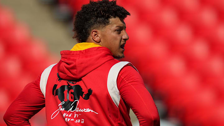 Aug 25, 2022; Kansas City, Missouri, USA; Kansas City Chiefs quarterback Patrick Mahomes (15) wears a shirt memorializing the death of hall of fame quarterback Len Dawson before a game against the Green Bay Packers at GEHA Field at Arrowhead Stadium. Mandatory Credit: Jay Biggerstaff-Imagn Images