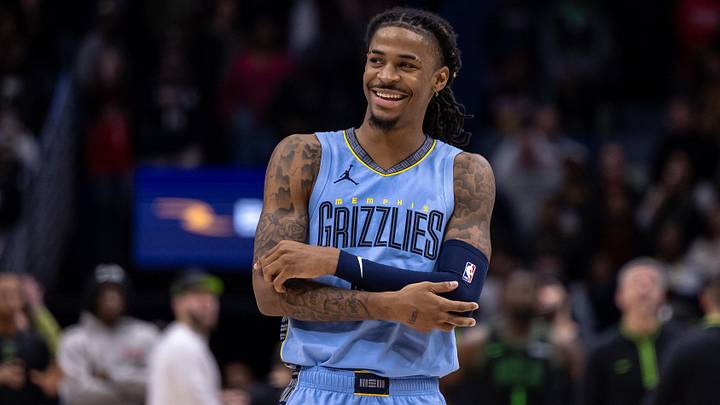 Dec 26, 2023; New Orleans, Louisiana, USA; Memphis Grizzlies guard Ja Morant (12) smiles at a fan as the end of regulation against the New Orleans Pelicans at Smoothie King Center. Mandatory Credit: Stephen Lew-Imagn Images