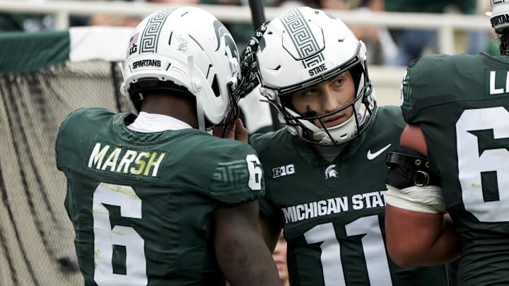 Oct 11, 2025; East Lansing, Michigan, USA; Michigan State wide receiver Nick Marsh (6) celebrates a touchdown against the UCLA Bruins with quarterback Alessio Milivojevic (11) in the fourth quarter at Spartan Stadium. Mandatory Credit: Brendan Mullin-Imagn Images