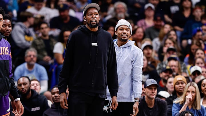 Oct 13, 2024; Denver, Colorado, USA; Phoenix Suns forward Kevin Durant (35) and guard Bradley Beal (3) look on in the third quarter against the Denver Nuggets at Ball Arena. Mandatory Credit: Isaiah J. Downing-Imagn Images
