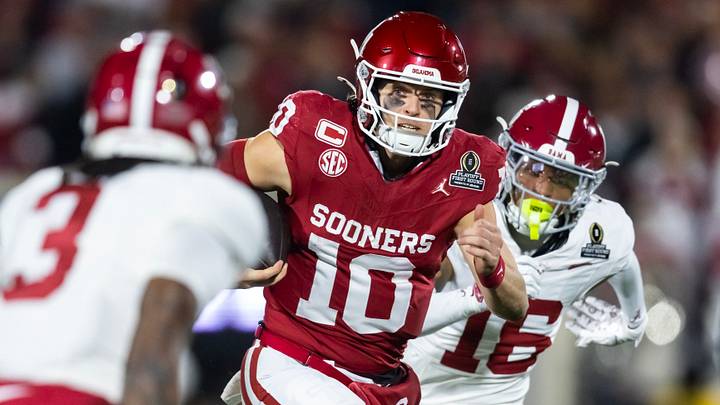 Oklahoma quarterback John Mateer rushes the ball against Alabama in the College Football Playoff.
