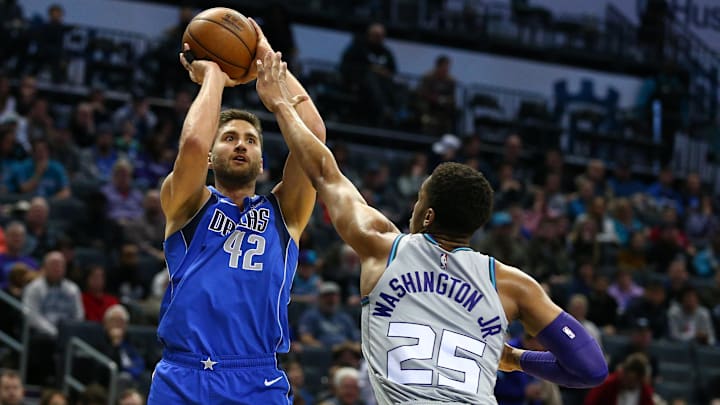 Feb 8, 2020; Charlotte, North Carolina, USA; Dallas Mavericks forward Maxi Kleber (42) shoots a three point basket against Charlotte Hornets forward PJ Washington (25) during the first half at Spectrum Center. Mandatory Credit: Jeremy Brevard-Imagn Images