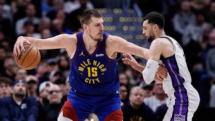 Mar 5, 2025; Denver, Colorado, USA; Denver Nuggets center Nikola Jokic (15) controls the ball as Sacramento Kings guard Zach LaVine (8) guards in the fourth quarter at Ball Arena. Mandatory Credit: Isaiah J. Downing-Imagn Images