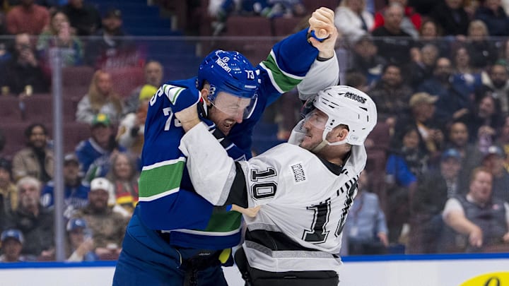 Jan 16, 2025; Vancouver, British Columbia, CAN; Vancouver Canucks defenseman Vincent Desharnais (73) fights with Los Angeles Kings forward Tanner Jeannot (10) in the first period at Rogers Arena. Mandatory Credit: Bob Frid-Imagn Images