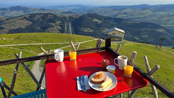 Breathtaking breakfast view in Appenzell, Switzerland, surrounded by stunning mountains. Breathtaking breakfast view in Appenzell, Switzerland, surrounded by stunning mountains.