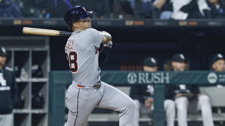 Jun 4, 2025; Chicago, Illinois, USA; Detroit Tigers center fielder Javier Baez (28) hits an RBI-single against the Chicago White Sox during the first inning at Rate Field. 