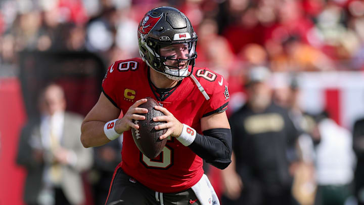 Jan 5, 2025; Tampa, Florida, USA; Tampa Bay Buccaneers quarterback Baker Mayfield (6) drops back to pass against the New Orleans Saints in the second quarter at Raymond James Stadium. Mandatory Credit: Nathan Ray Seebeck-Imagn Images Jan 5, 2025; Tampa, Florida, USA; Tampa Bay Buccaneers quarterback Baker Mayfield (6) drops back to pass against the New Orleans Saints in the second quarter at Raymond James Stadium. Mandatory Credit: Nathan Ray Seebeck-Imagn Images