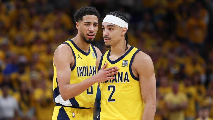 May 31, 2025; Indianapolis, Indiana, USA; Indiana Pacers guard Tyrese Haliburton (0) and guard Andrew Nembhard (2) speak in the second quarter during game six of the eastern conference finals against the New York Knicks for the 2025 NBA Playoffs at Gainbridge Fieldhouse. Mandatory Credit: Trevor Ruszkowski-Imagn Images