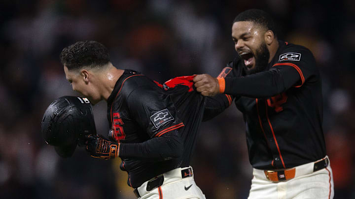 San Francisco, California, USA; San Francisco Giants designated hitter Wilmer Flores (left) and Heliot Ramos (right) celebrate their extra-inning win over the Athletics at Oracle Park. San Francisco, California, USA; San Francisco Giants designated hitter Wilmer Flores (left) and Heliot Ramos (right) celebrate their extra-inning win over the Athletics at Oracle Park.