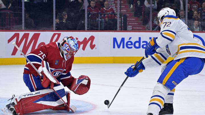 Oct 20, 2025; Montreal, Quebec, CAN; Montreal Canadiens goalie Jakub Dobes (75) stops a shot by Buffalo Sabres forward Tage Thompson (72) during the second period at the Bell Centre. Mandatory Credit: Eric Bolte-Imagn Images