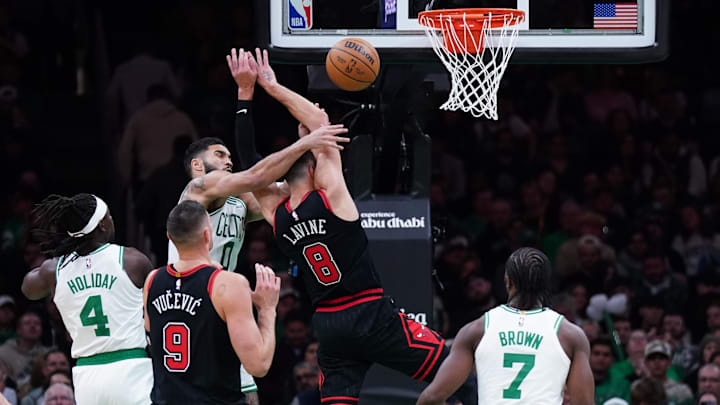  Boston Celtics forward Jayson Tatum (0) fouls Chicago Bulls guard Zach LaVine (8) in the second quarter at TD Garden. Mandatory Credit: David Butler II-Imagn Images
