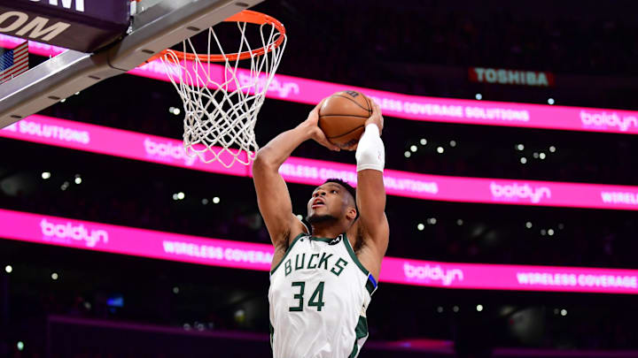Jan 9, 2026; Los Angeles, California, USA; Milwaukee Bucks forward Giannis Antetokounmpo (34) dunks for the basket against the Los Angeles Lakers during the first half at Crypto.com Arena. Mandatory Credit: Gary A. Vasquez-Imagn Images