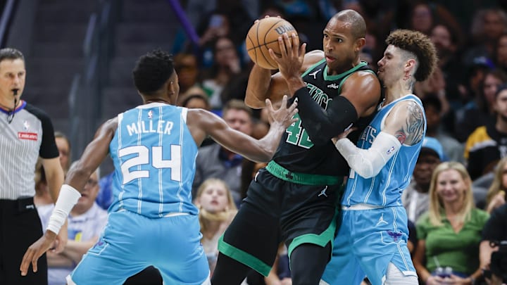 Nov 2, 2024; Charlotte, North Carolina, USA; Boston Celtics center Al Horford (42) tries to pass out of a double team by Charlotte Hornets forward Brandon Miller (24) and guard LaMelo Ball (1) during the second half at Spectrum Center. Mandatory Credit: Nell Redmond-Imagn Images Nov 2, 2024; Charlotte, North Carolina, USA; Boston Celtics center Al Horford (42) tries to pass out of a double team by Charlotte Hornets forward Brandon Miller (24) and guard LaMelo Ball (1) during the second half at Spectrum Center. Mandatory Credit: Nell Redmond-Imagn Images