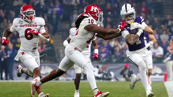 Kansas State wide receiver Jayce Brown (1) sprints downfield before being pushed out of bounds by Rutgers cornerback Flip Dixon (10) during first half of the Rate Bowl at Chase Field on Dec. 26, 2024, in Phoenix.
