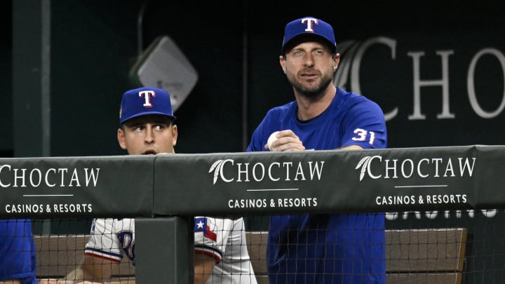 Jun 3, 2024; Arlington, Texas, USA; Texas Rangers starting pitcher Max Scherzer (31) watches from the dugout during the sixth inning against the Detroit Tigers at Globe Life Field. Mandatory Credit: Jerome Miron-USA TODAY Sports