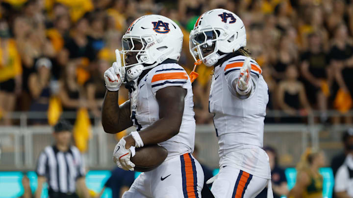 Aug 29, 2025; Waco, Texas, USA;  Auburn Tigers running back Damari Alston (0) celebrates after scoring a touchdown against the Baylor Bears during the first half at McLane Stadium. Mandatory Credit: Chris Jones-Imagn Images