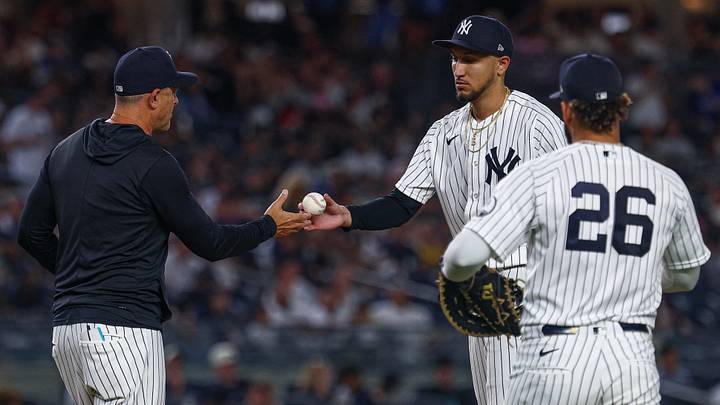 Aug 26, 2026; Bronx, New York, USA; New York Yankees pitcher Elmer Rodriguez (71) hands the ball to manager Aaron Boone (17) during the seventh inning against the Houston Astros at Yankee Stadium. Mandatory Credit: Vincent Carchietta-Imagn Images Aug 26, 2026; Bronx, New York, USA; New York Yankees pitcher Elmer Rodriguez (71) hands the ball to manager Aaron Boone (17) during the seventh inning against the Houston Astros at Yankee Stadium. Mandatory Credit: Vincent Carchietta-Imagn Images