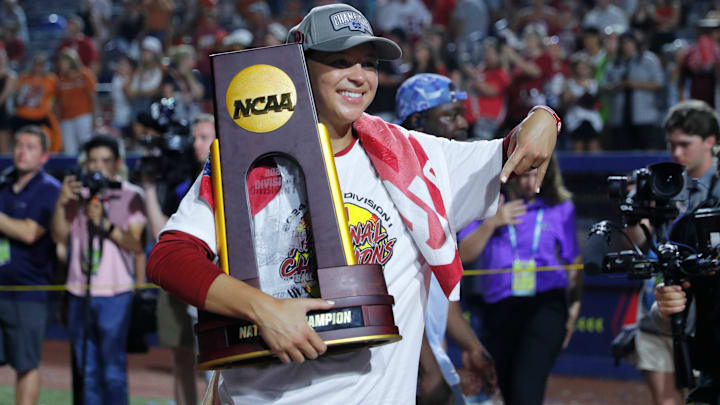Oklahoma outfielder Jayda Coleman (24) poses for a photo with the trophy after winning Game 2 of the NCAA softball Women's College World Series Championship Series game between the Oklahoma Sooners (OU) and Texas Longhorns at Devon Park in Oklahoma City, Thursday, June 6, 2024. Oklahoma won 8-4.