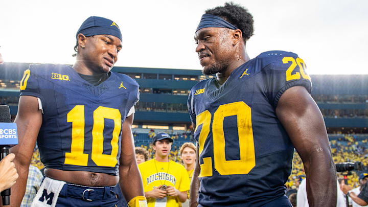Former Michigan QB Alex Orji (10) and RB Kalel Mullings (20)