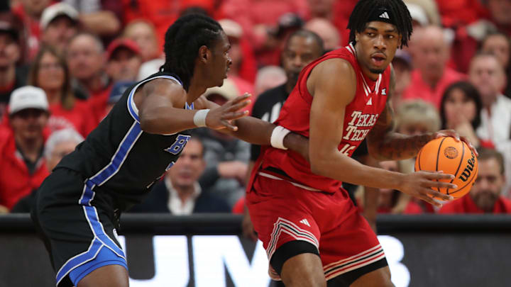 Jan 17, 2026; Lubbock, Texas, USA;  Texas Tech Red Raiders forward JT Toppin (15) dribbles the ball against BYU Cougars guard Khadim Mboup (7) in the second half at United Supermarkets Arena. Mandatory Credit: Michael C. Johnson-Imagn Images