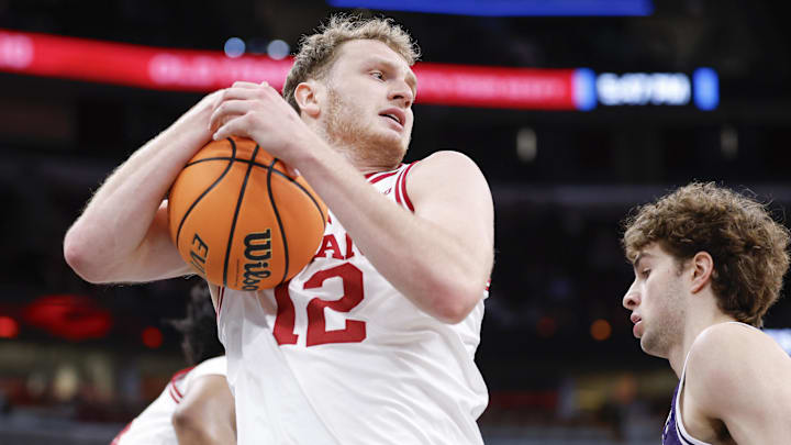 Mar 11, 2026; Chicago, IL, USA; Indiana Hoosiers forward Tucker Devries (12) grabs a rebound against the Northwestern Wildcats during the first half at United Center. Mar 11, 2026; Chicago, IL, USA; Indiana Hoosiers forward Tucker Devries (12) grabs a rebound against the Northwestern Wildcats during the first half at United Center.