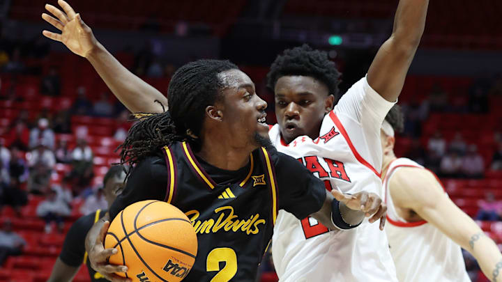 Feb 4, 2026; Salt Lake City, Utah, USA; Arizona State Sun Devils guard Anthony Johnson (2) goes to the basket against Utah Utes guard Obomate Abbey (21) during the first half at Jon M. Huntsman Center. Mandatory Credit: Rob Gray-Imagn Images