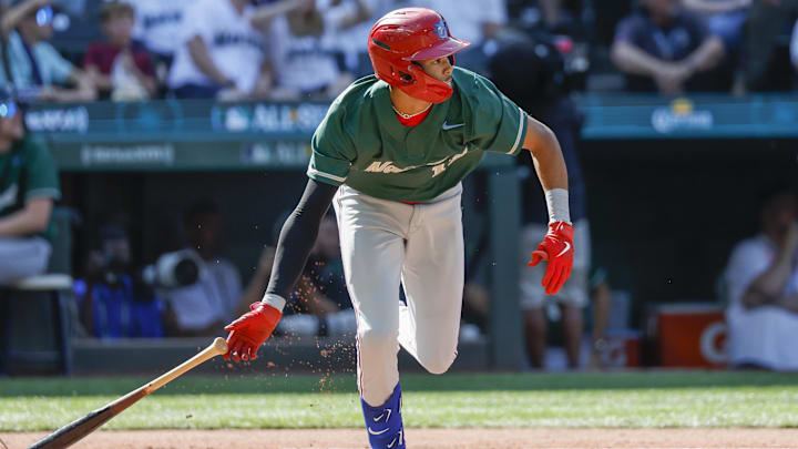 Jul 8, 2023; Seattle, Washington, USA; National League Futures designated hitter Justin Crawford (13) of the Philadelphia Phillies hits an RBI-sacrifice fly against the American League Futures during the second inning of the All Star-Futures Game at T-Mobile Park.