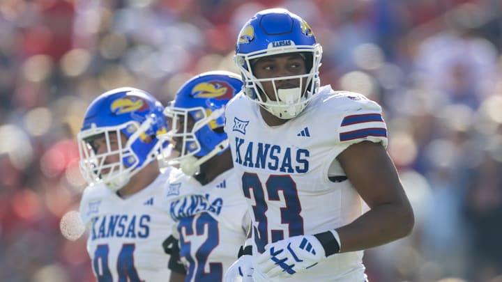 Nov 8, 2025; Tucson, Arizona, USA; Kansas Jayhawks defensive end Leroy Harris III (33) against the Arizona Wildcats at Arizona Stadium. Mandatory Credit: Mark J. Rebilas-Imagn Images
