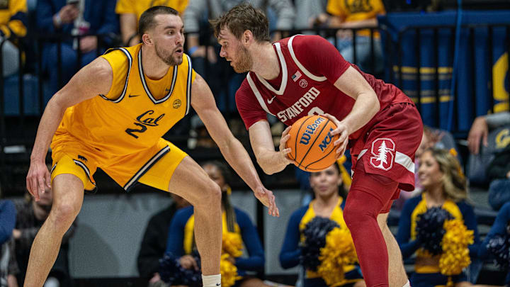 Feb 21, 2026; Berkeley, California, USA;  Stanford Cardinal forward Aidan Cammann (52) is defended by California Golden Bears forward John Camden (2) during the second half at Haas Pavilion. Mandatory Credit: Neville E. Guard-Imagn Images