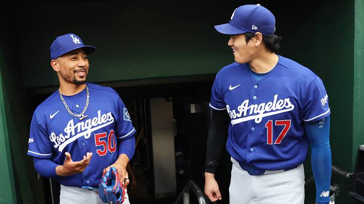 Los Angeles Dodgers shortstop Mookie Betts (50) and two-way player Shohei Ohtani (17) talk in the dugout before the game against the Pittsburgh Pirates at PNC Park on June 11, 2026.