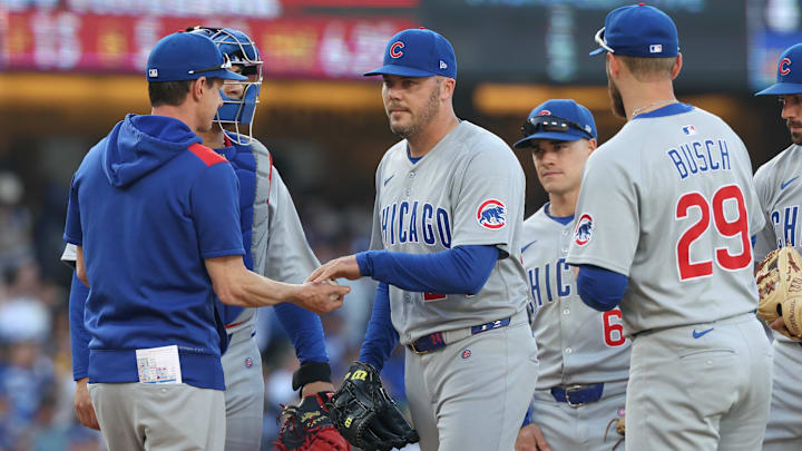 Apr 13, 2025; Los Angeles, California, USA; Chicago Cubs pitcher Caleb Thielbar (24) hand the ball to Chicago Cubs manager Craig Counsell (11) as he leaves the game against the Los Angeles Dodgers during the sixth inning at Dodger Stadium. Apr 13, 2025; Los Angeles, California, USA; Chicago Cubs pitcher Caleb Thielbar (24) hand the ball to Chicago Cubs manager Craig Counsell (11) as he leaves the game against the Los Angeles Dodgers during the sixth inning at Dodger Stadium.