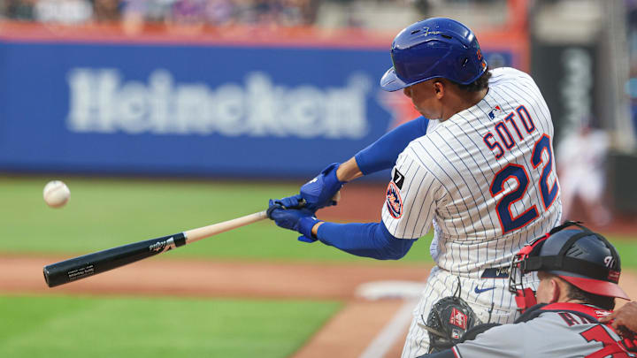 New York City, New York, USA; New York Mets right fielder Juan Soto (22) hits a two-run home run during the third inning against the Washington Nationals at Citi Field.