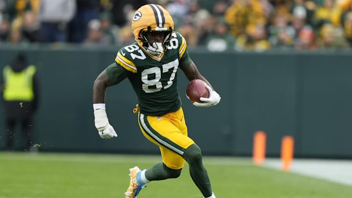 Nov 23, 2025; Green Bay, Wisconsin, USA; Green Bay Packers wide receiver Romeo Doubs (87) carries the ball Minnesota Vikings during the second half at Lambeau Field. 