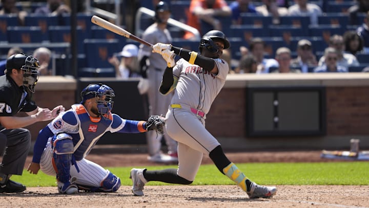 May 1, 2025; New York City, New York, USA; Arizona Diamondbacks shortstop Geraldo Perdomo (2) hits a home run against the New York Mets during the seventh inning at Citi Field. Mandatory Credit: Gregory Fisher-Imagn Images