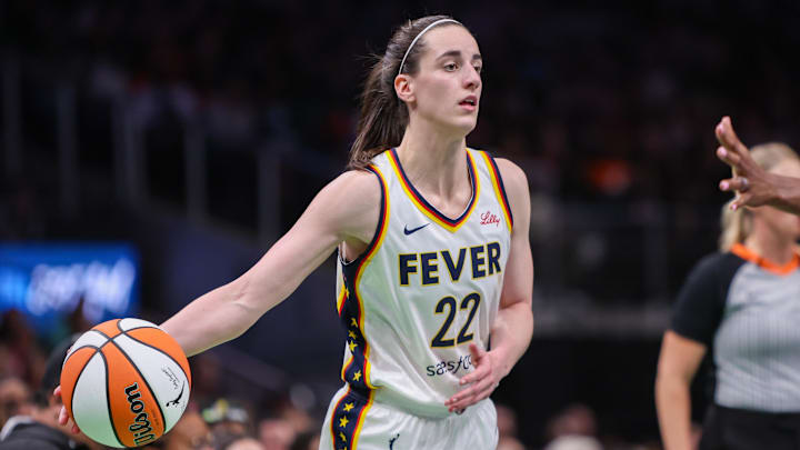 May 22, 2025; Atlanta, Georgia, USA; Indiana Fever guard Caitlin Clark (22) passes the ball against the Atlanta Dream in the third quarter at State Farm Arena. Mandatory Credit: Brett Davis-Imagn Images