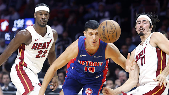 Oct 28, 2024; Miami, Florida, USA; Miami Heat forward Jimmy Butler (22), guard Jaime Jaquez Jr. (11) and Detroit Pistons forward Simone Fontecchio (19) go after a loose ball during the second half at Kaseya Center. Mandatory Credit: Rhona Wise-Imagn Images